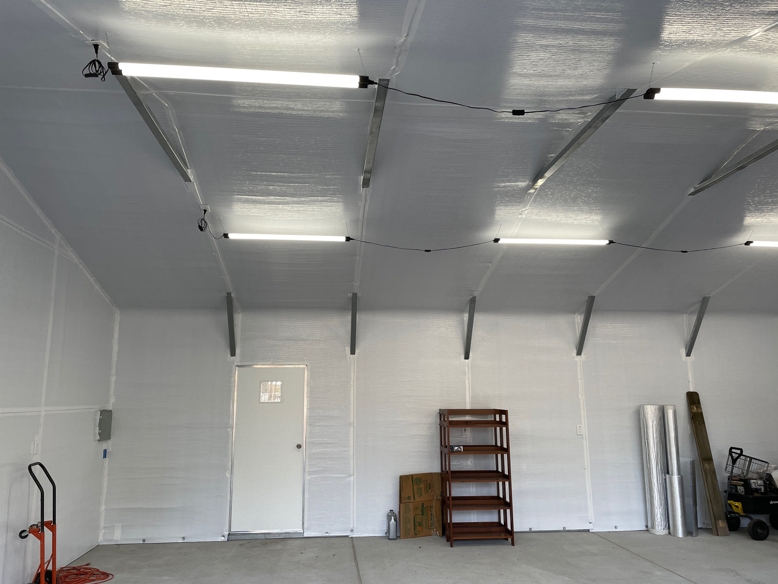 Finished BlueTex™ Insulation wall install in a residential metal shop interior