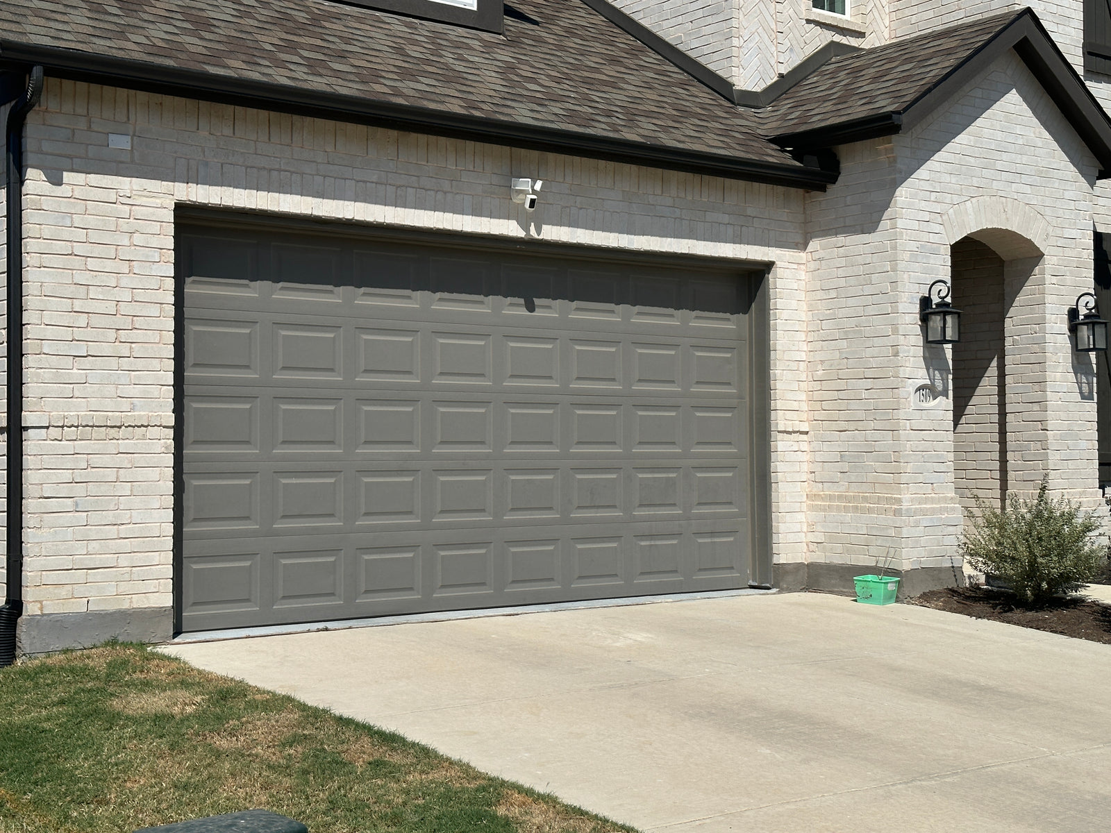 Residential panel garage door from outside the home